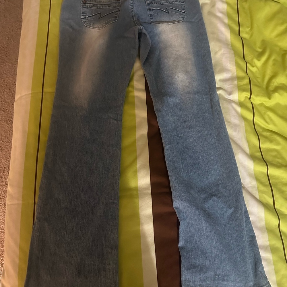 Size 11, never worn. Stretchy, low rise